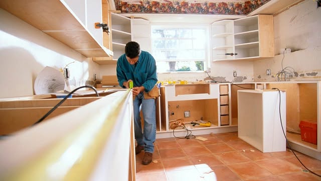 Contractor renovating a home kitchen